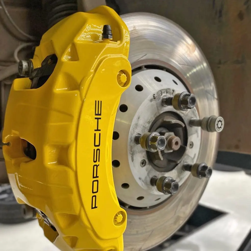 Painted calipers on a Porsche, wheel detail, at Ecophant Auto Boca Raton
