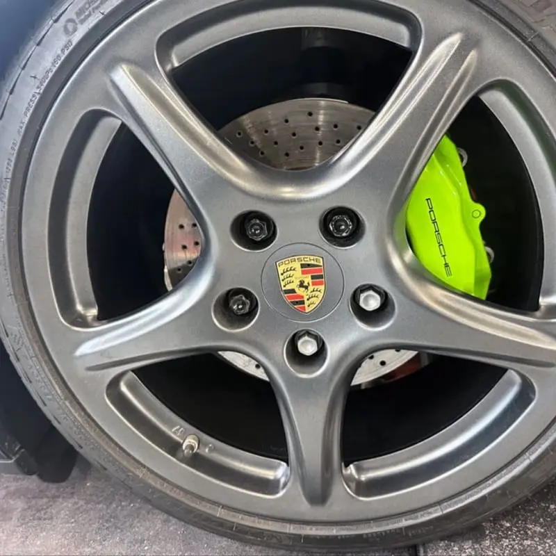 Painted calipers on a Porsche, close-up, at Ecophant Auto Boca Raton