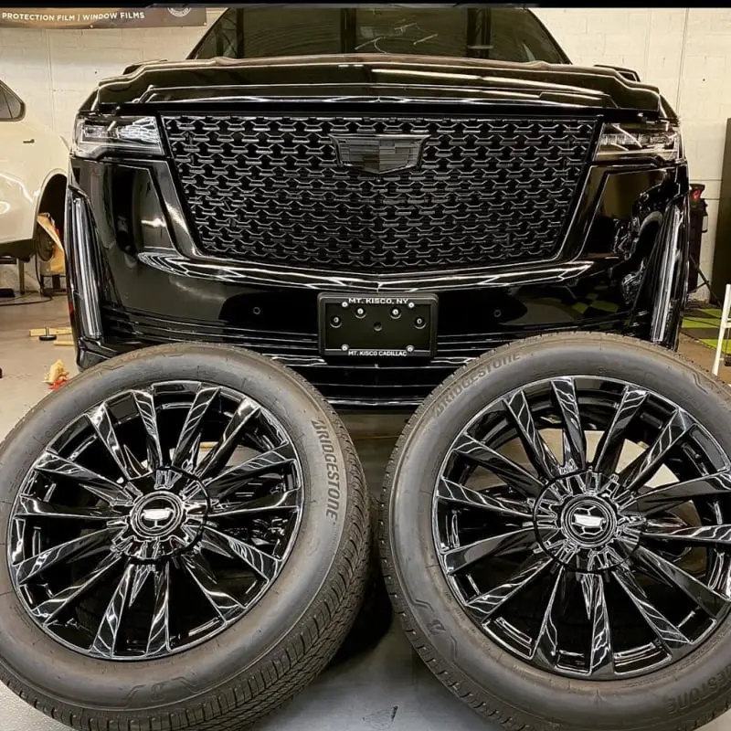 Aftermarket black wheel, detail view, at Ecophant Auto Boca Raton