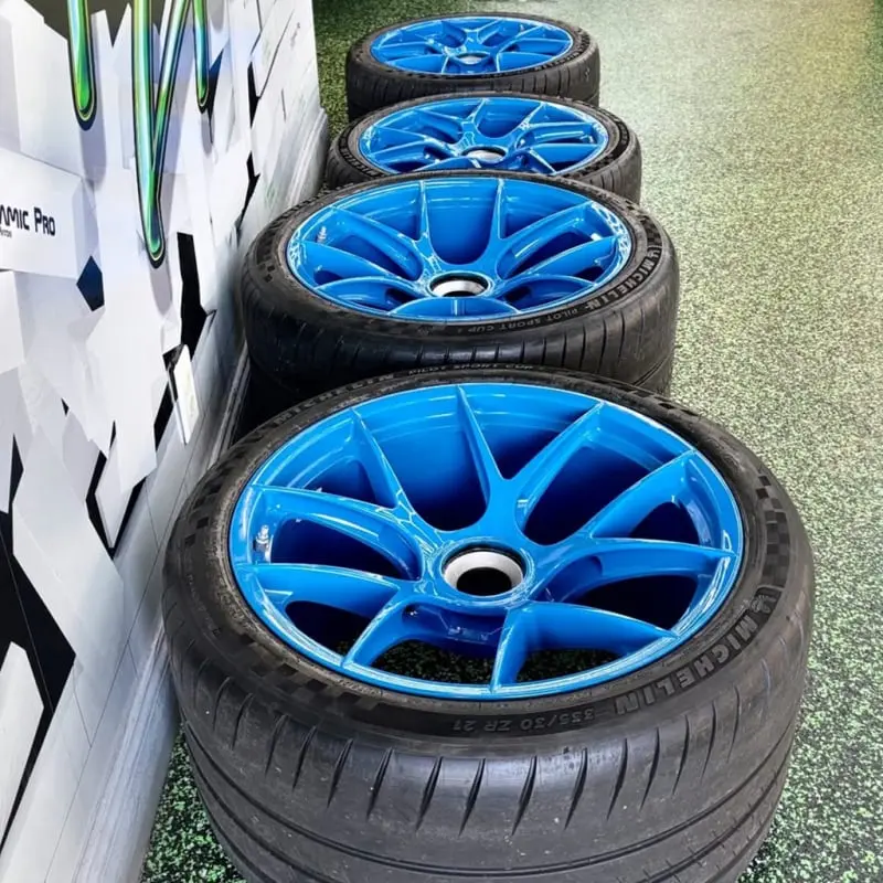 Aftermarket blue wheel at Ecophant Auto Boca Raton