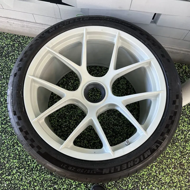Aftermarket white wheel, detail view, at Ecophant Auto Boca Raton