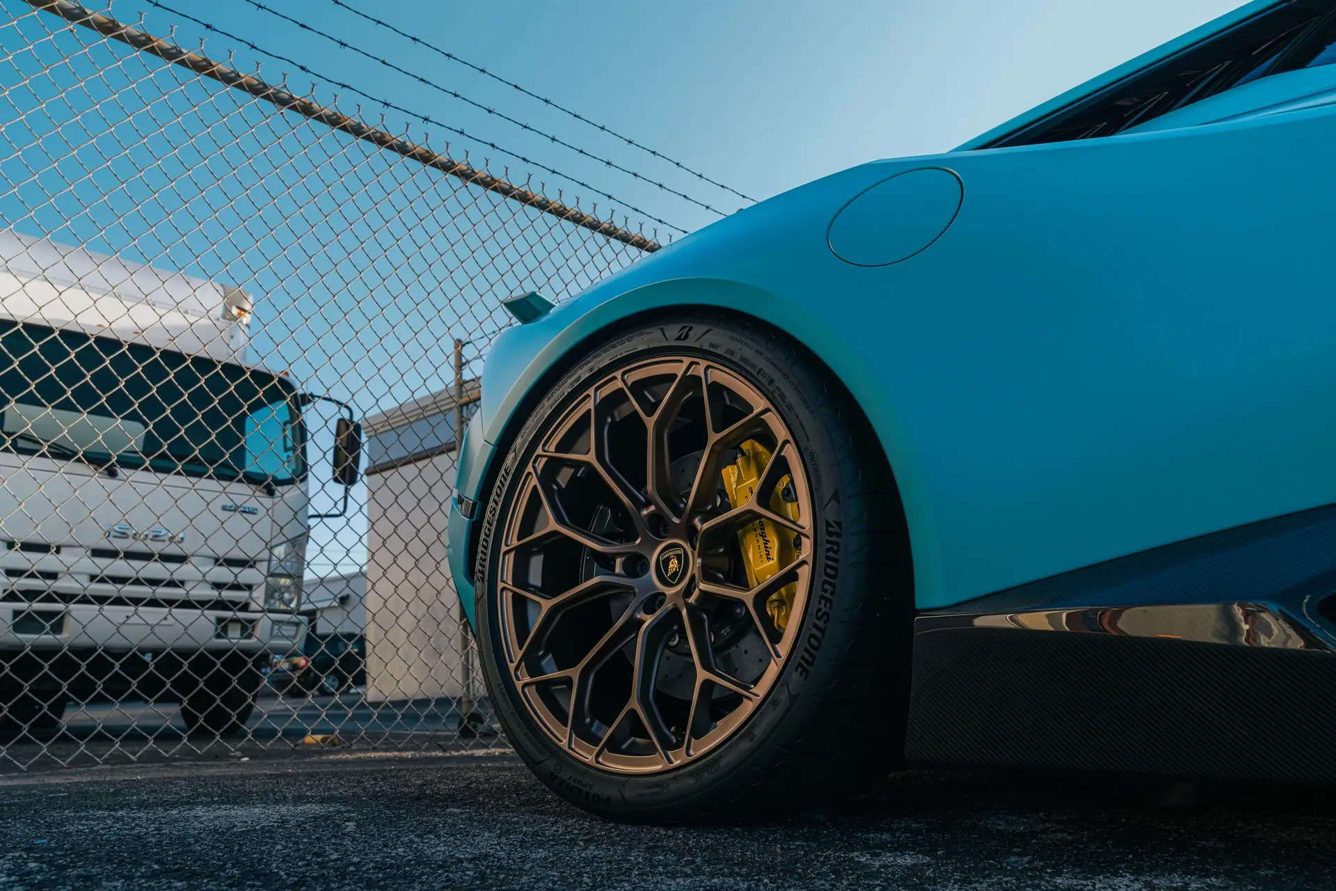 Wheel and brake caliper detail on a ceramic-coated Lamborghini Huracan Tecnica at Ecophant Auto Boca Raton