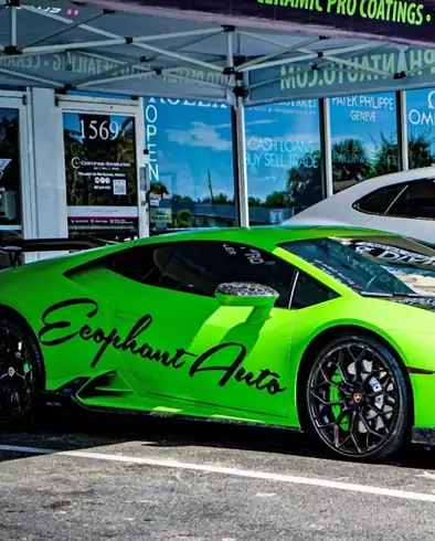 Green Lamborghini Huracan with Ecophant Auto livery in Boca Raton, Florida