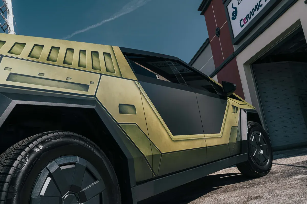 Cybertruck with a custom Warthog-style vinyl wrap at Ecophant Auto Boca Raton