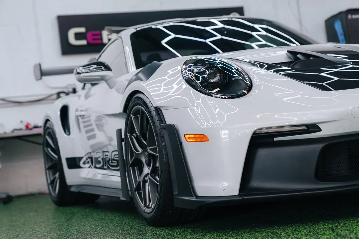 White Porsche 992 GT3RS with professional window tinting at Ecophant Auto in Boca Raton